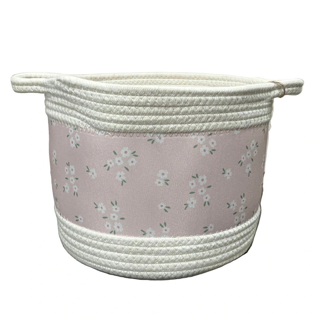A sophisticated Woven Storage Basket featuring delicate floral embroidery and a breathtaking architectural hand-woven texture.